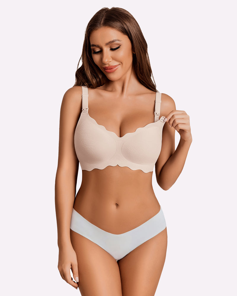 Seamless beige maternity nursing bra with adjustable straps and scalloped design.