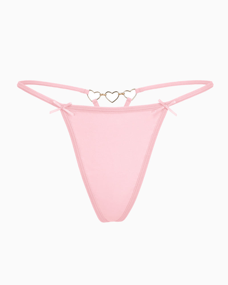 Pink G-string thong with gold heart ring and bow details. Comfortable and sexy lingerie for women.