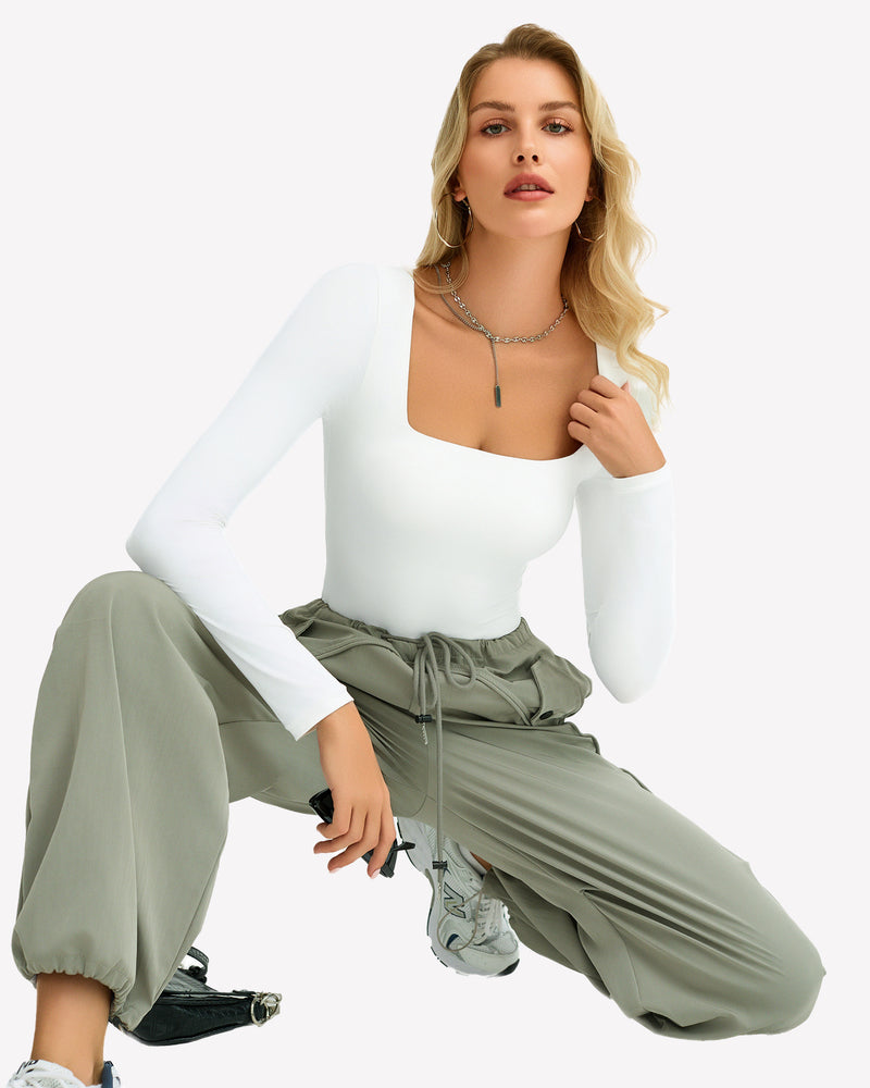 White square neck bodysuit with green cargo pants, ultra-stretchy, shows bodyline.