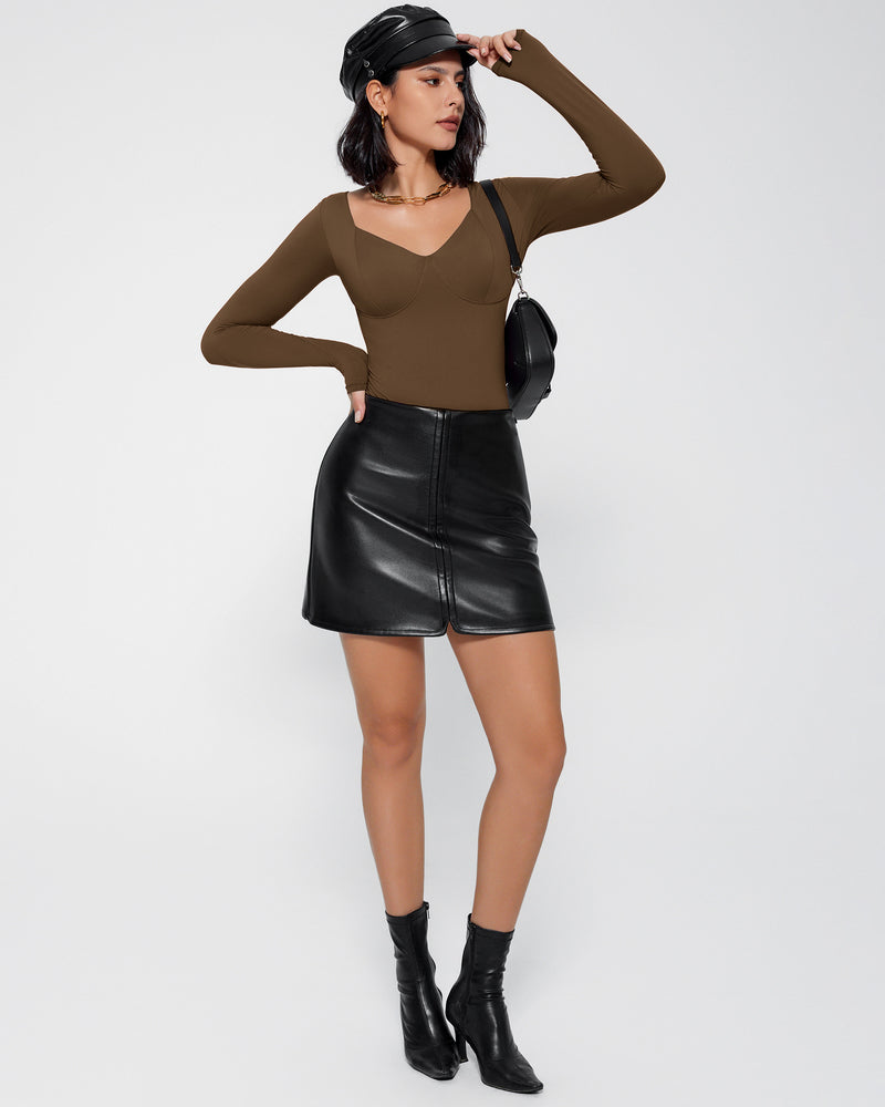 Brown V-neck bodysuit shapewear with long sleeves, black leather skirt, stylish look