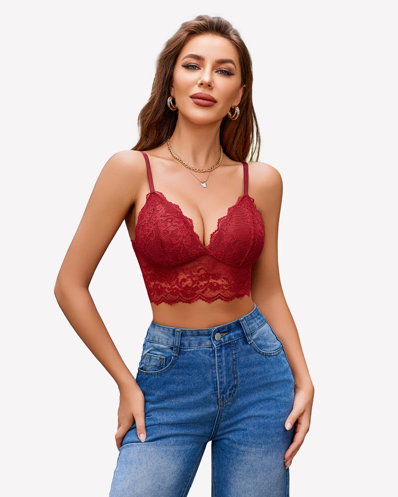 Burgundy red floral lace bustier crop top with adjustable spaghetti straps, paired with denim jeans.