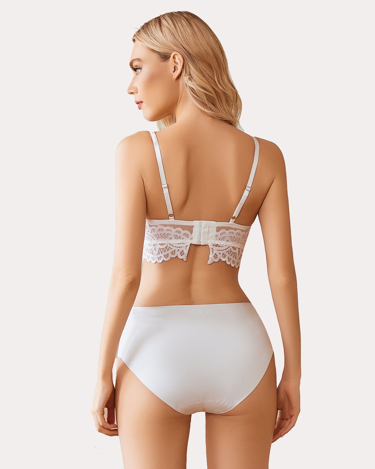 White lace bralette with adjustable straps and matching underwear. Full coverage bra.