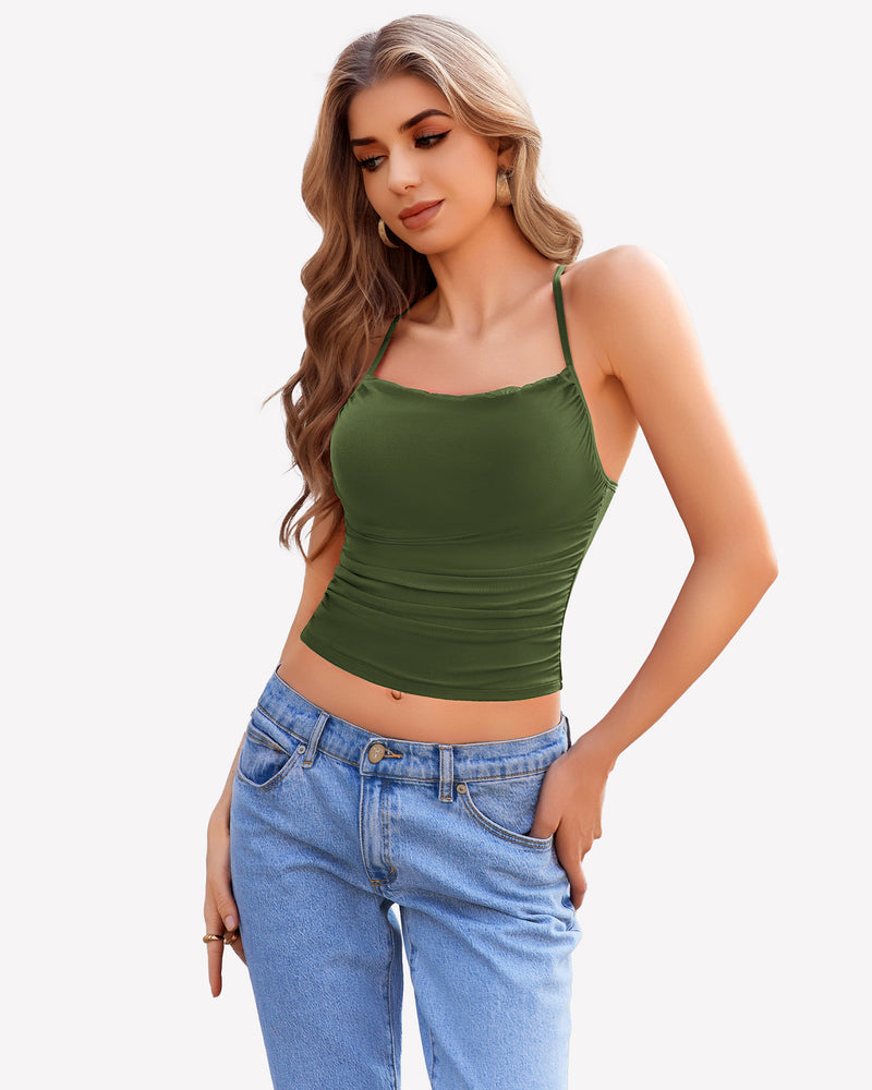 Green ruched cowl neck camisole, adjustable straps, paired with blue jeans. Stylish outfit.
