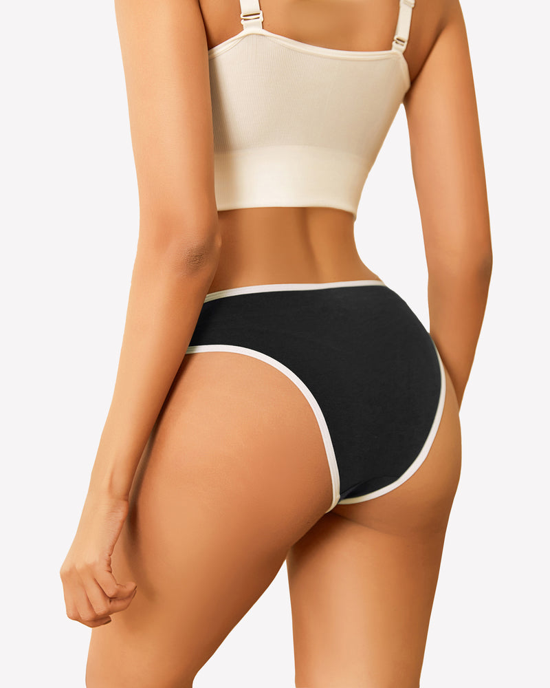 Black cotton hipster panty with white trim, low rise design, paired with a beige crop top.