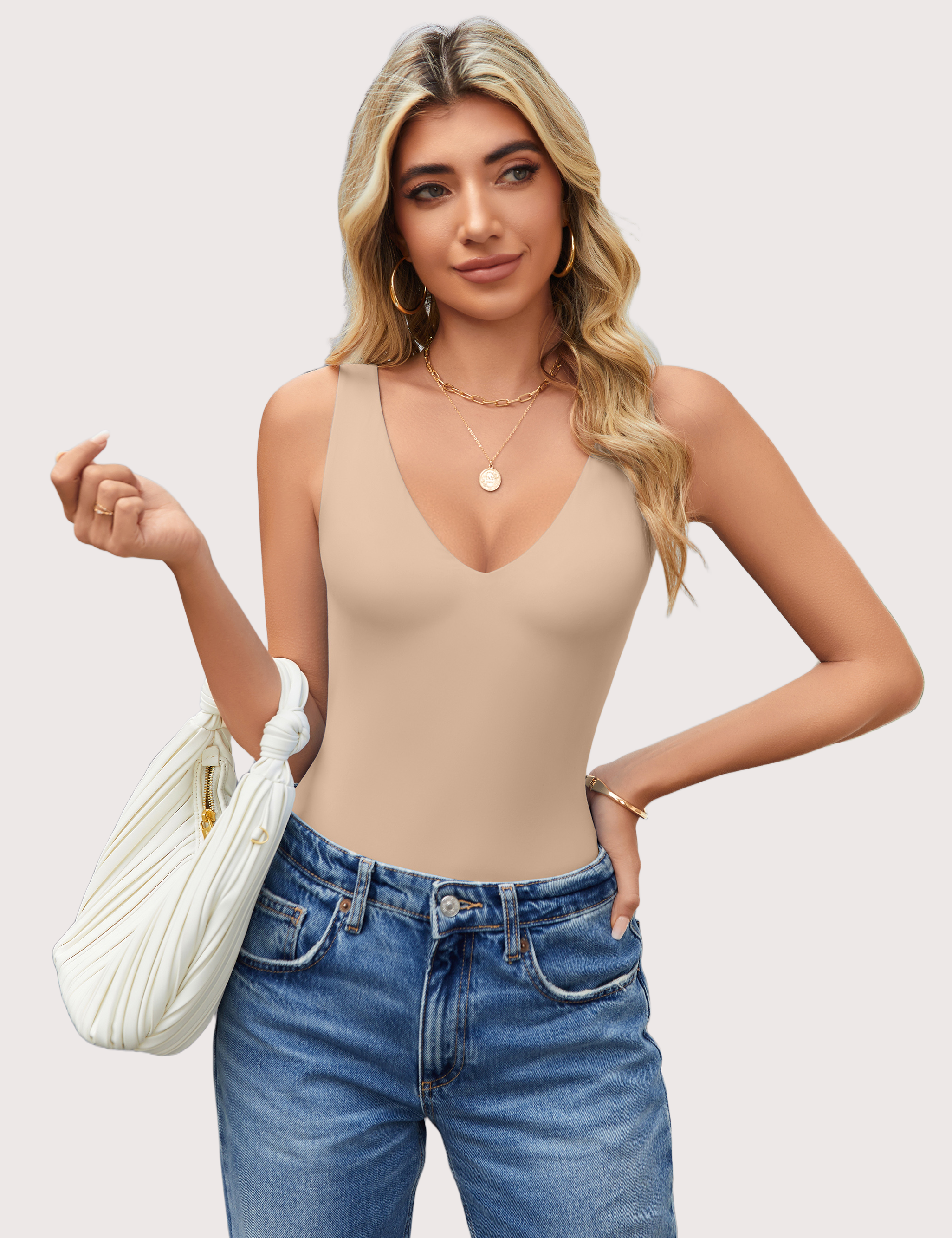 Beige plunging V-neck bodysuit leotard, paired with blue jeans, a must-have.