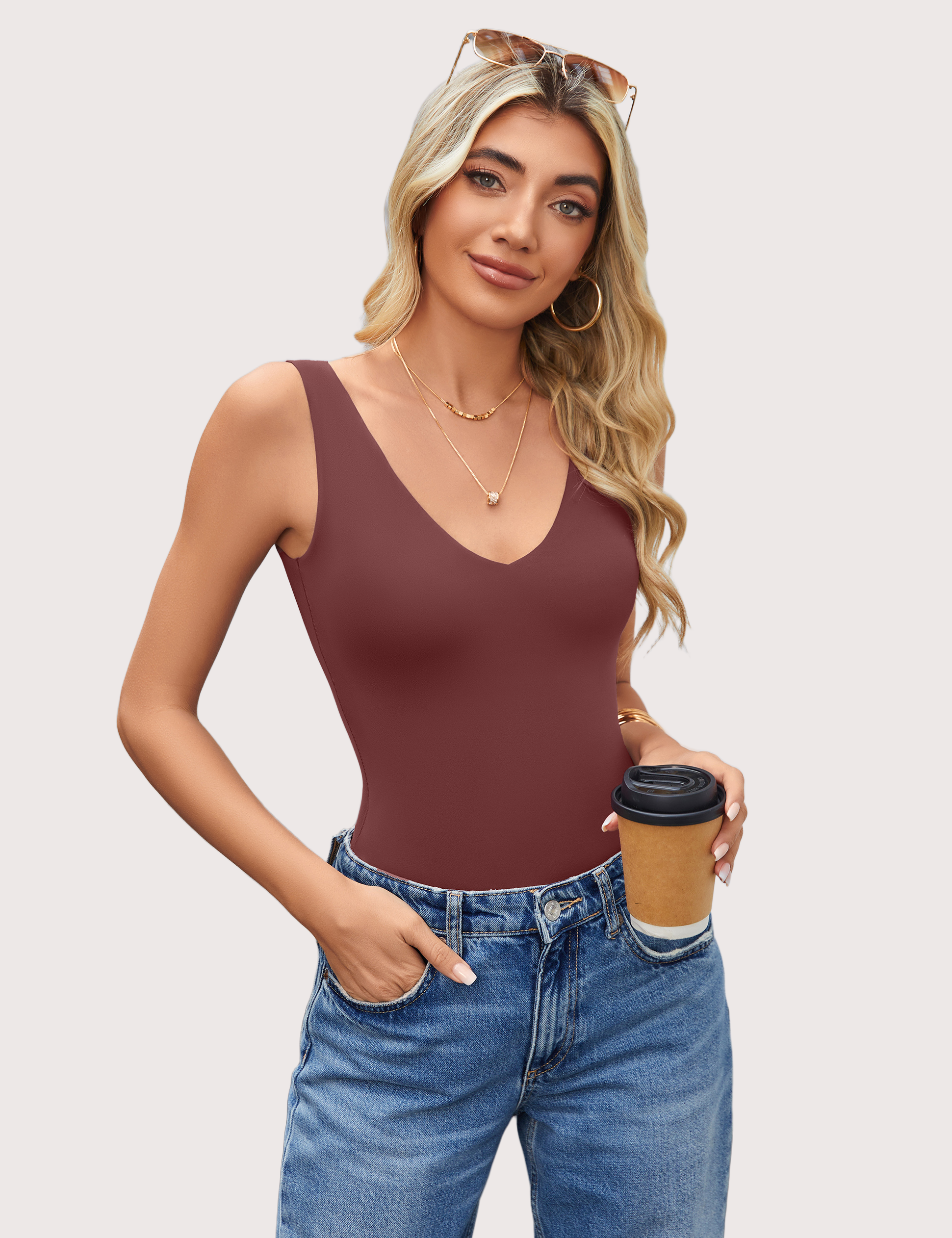 Burgundy double-lined bodysuit leotard with plunging V-neck, paired with blue jeans, a must-have.
