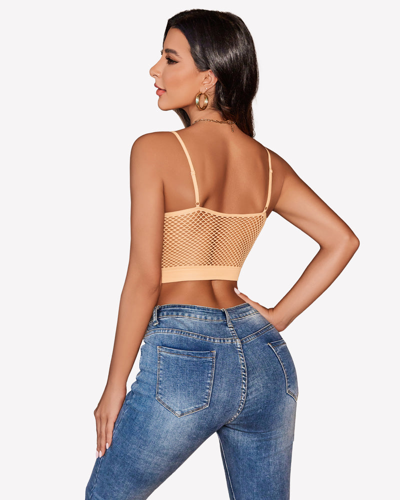 Peach fishnet crop top bralette with blue jeans, showing attractive curves. Y2k lingerie.