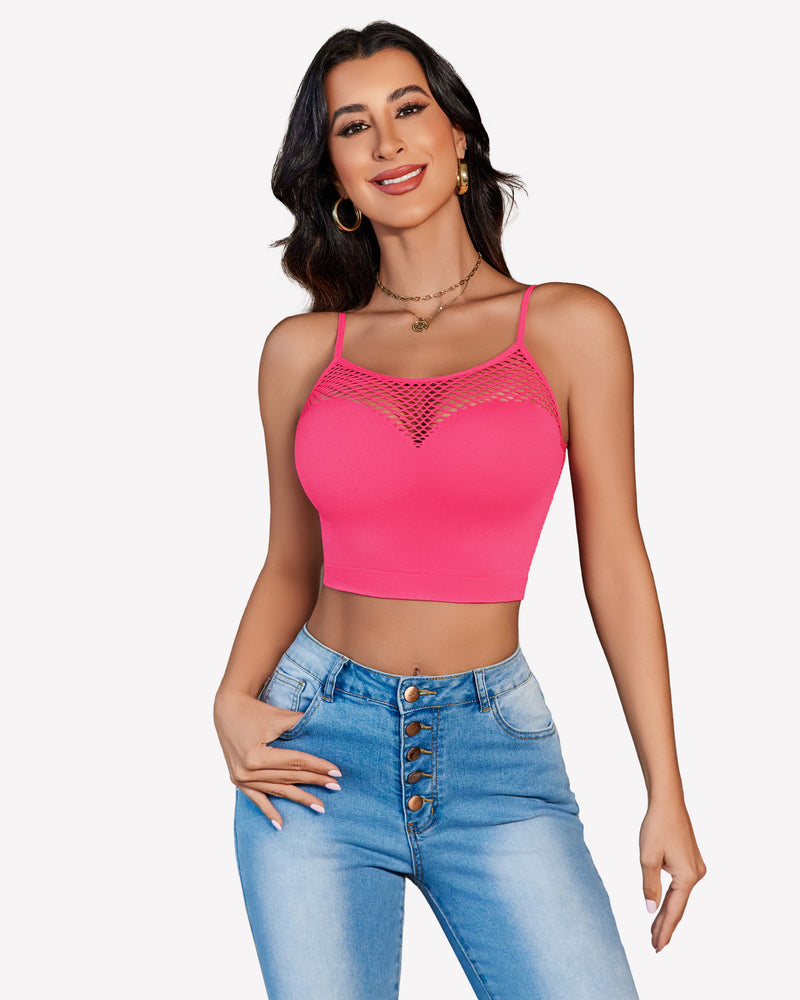 Pink fishnet crop top Y2k bralette, mesh detail, paired with jeans, showing curves.