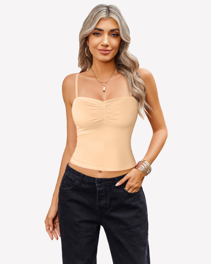 Beige ruched camisole crop top with adjustable straps and black jeans, a cute outfit.