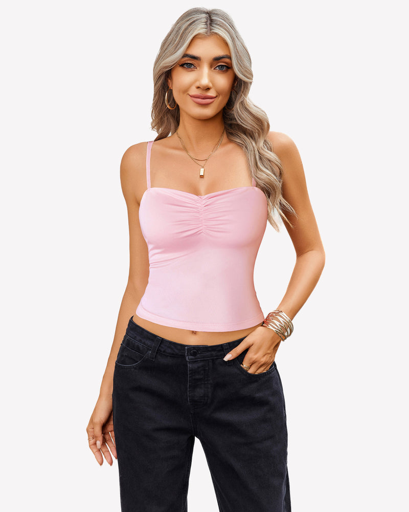 Pink ruched camisole crop top with black jeans, a cute outfit for women.