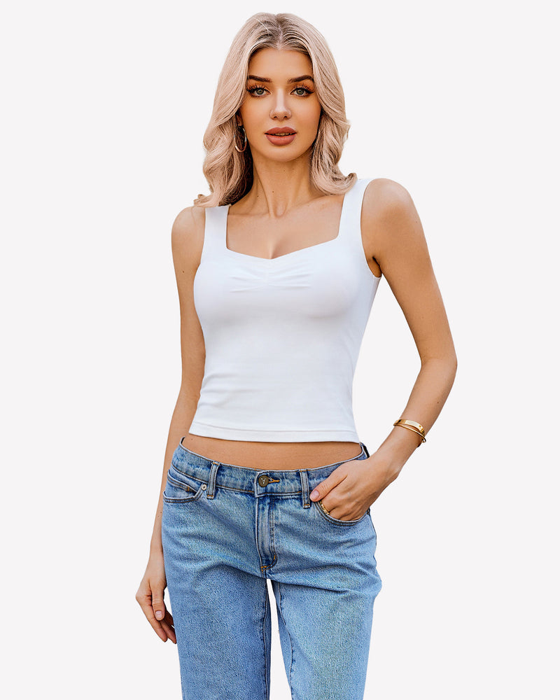 White sweetheart neckline crop tank top, ruched detail, sleeveless Y2K style, with blue jeans