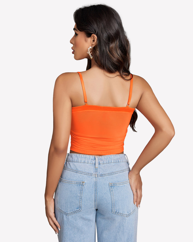 Orange ruched mesh Y2K tank top. Women's crop top with spaghetti straps and ruched design.