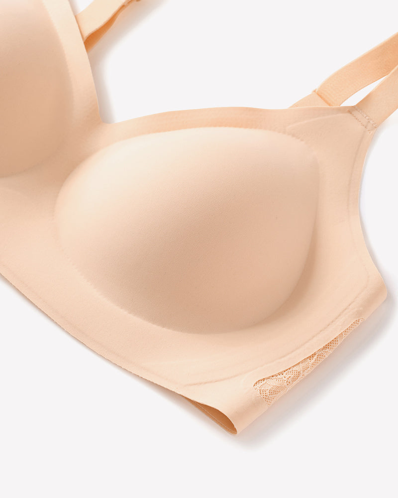 Beige seamless V-neck bra with padded cups, lace detail, and adjustable straps