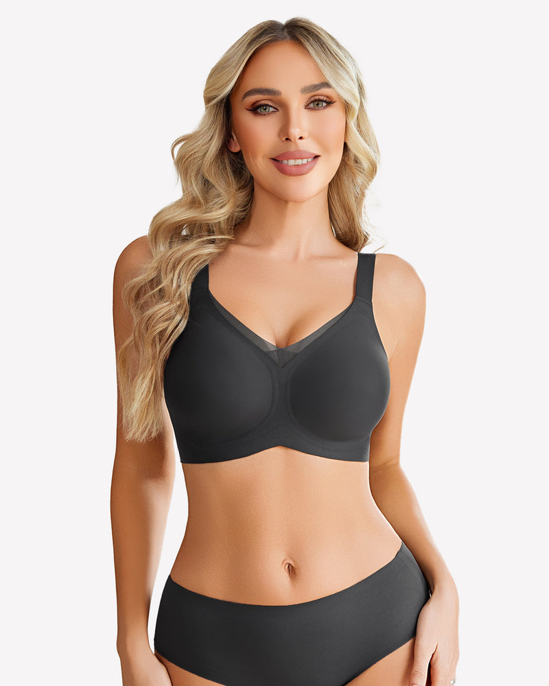 Seamless black comfort bra with no underwire, modeled by a smiling woman, all-day comfort