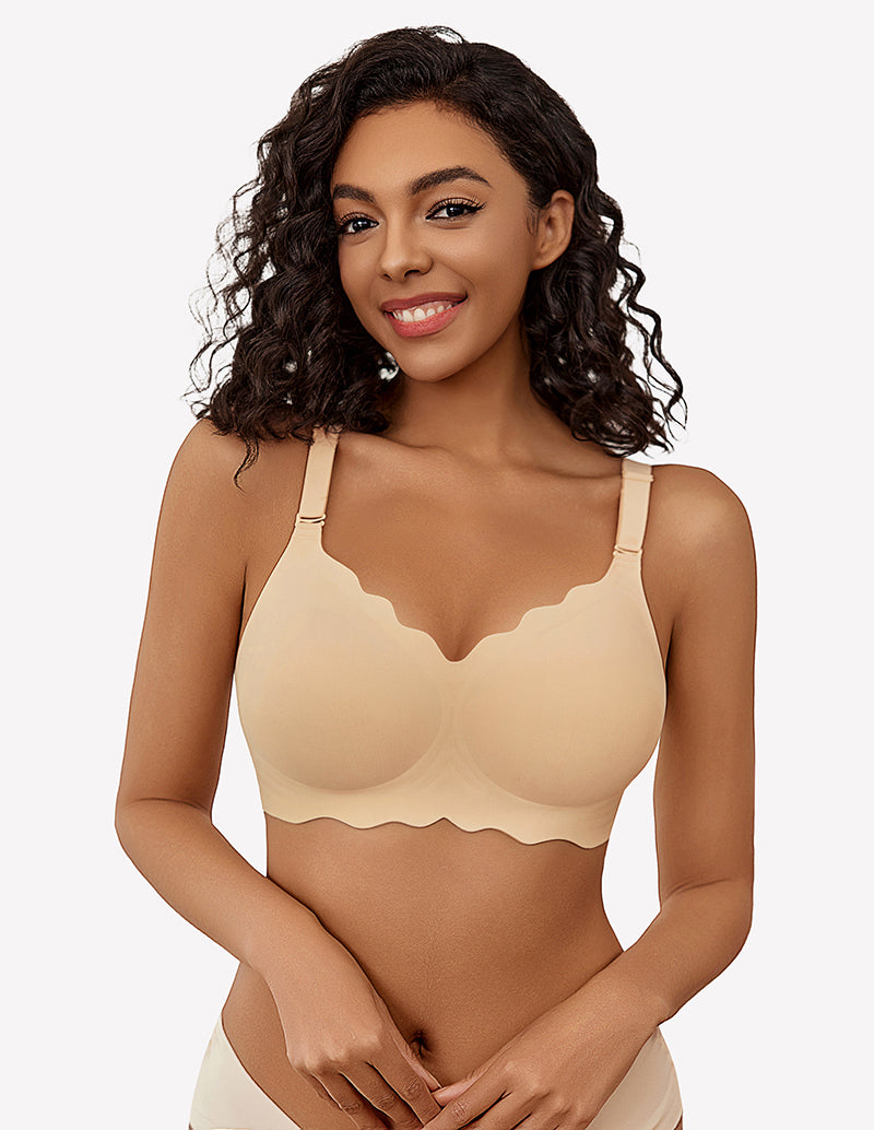 Beige wireless full coverage push up bra with scalloped edges, smiling model.