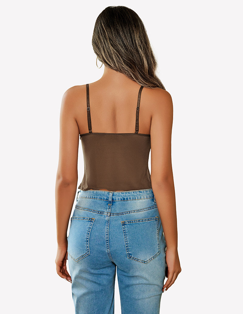 Brown mesh crop top with adjustable straps and high-waisted jeans. Y2K summer fashion.