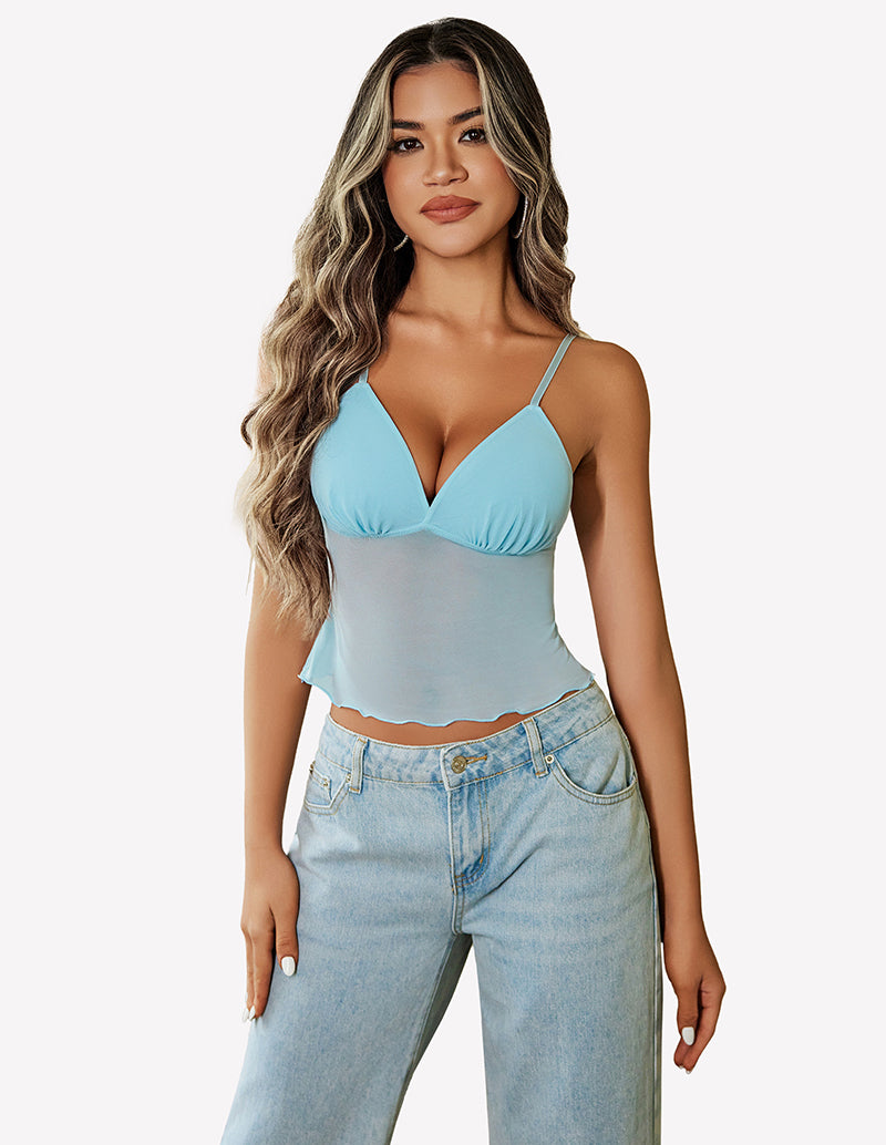 Light blue mesh crop top with adjustable straps, paired with high-waisted jeans. Y2K summer fashion.