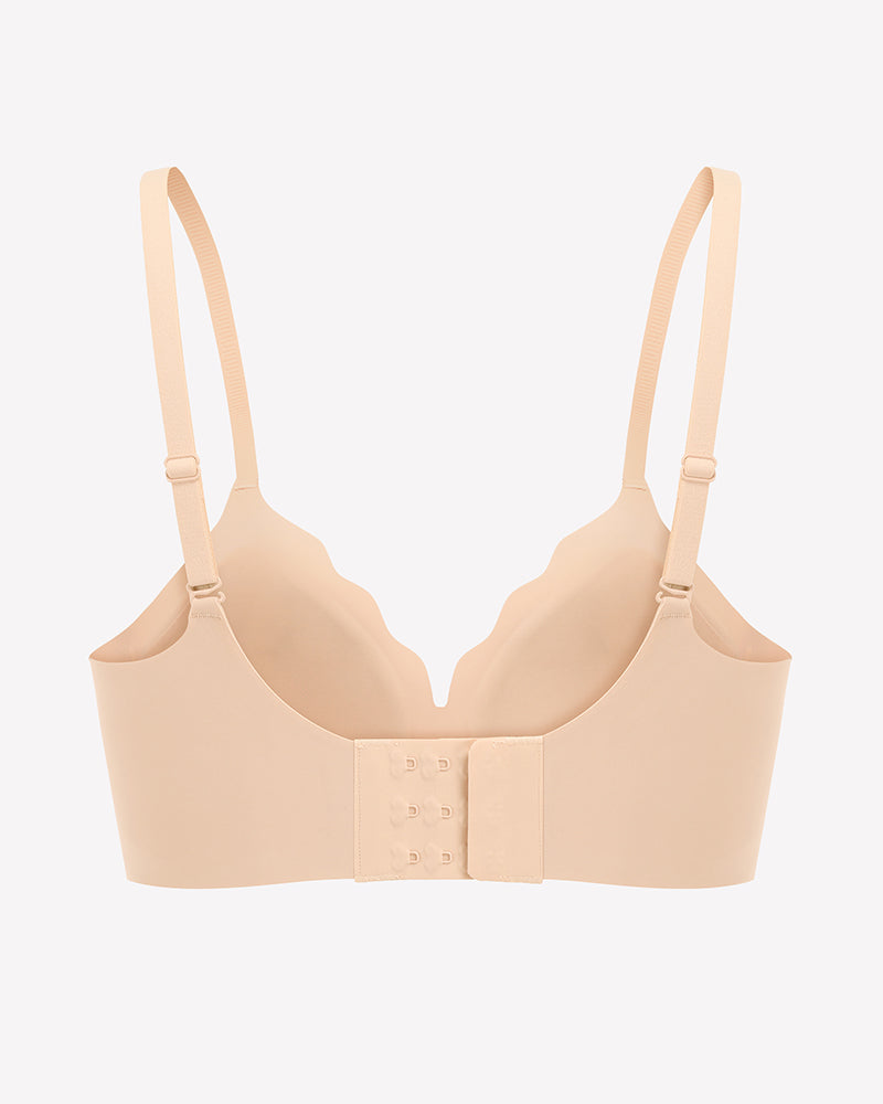 Beige seamless push-up wireless bra with scalloped V-neck design and adjustable straps