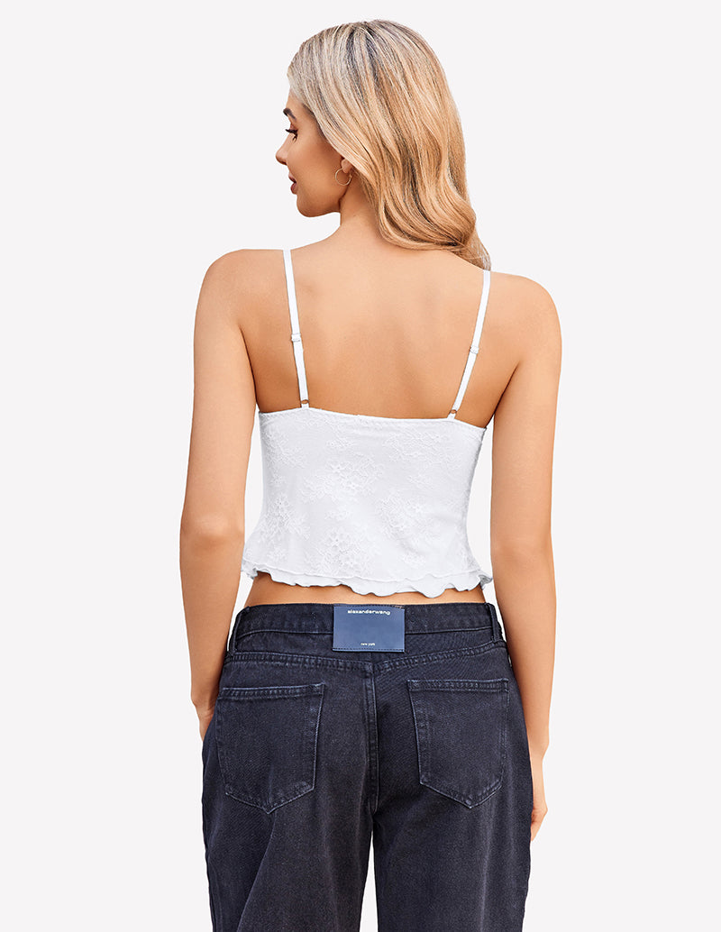 White Y2k lace tank top, spaghetti straps, and dark wash jeans. Y2k going out style.