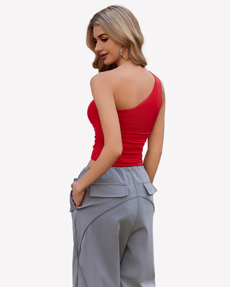 Red one-shoulder crop top and gray cargo pants. Stylish and casual outfit.