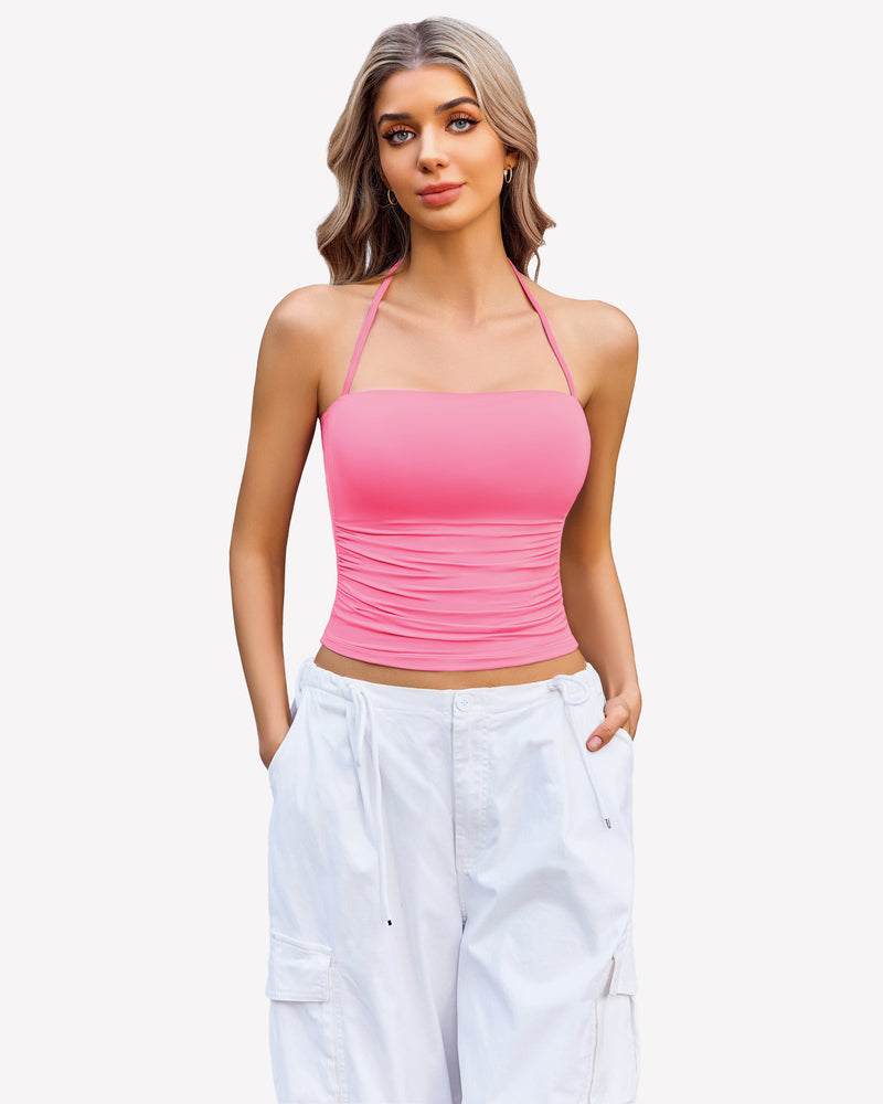 Pink ruched halter crop top with white cargo pants, perfect for a night out
