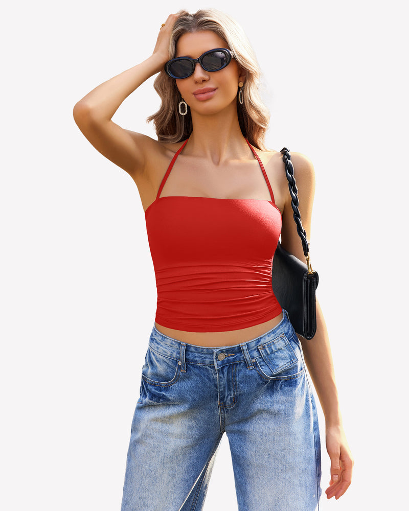 Red ruched halter crop top and blue jeans, stylish going-out outfit.