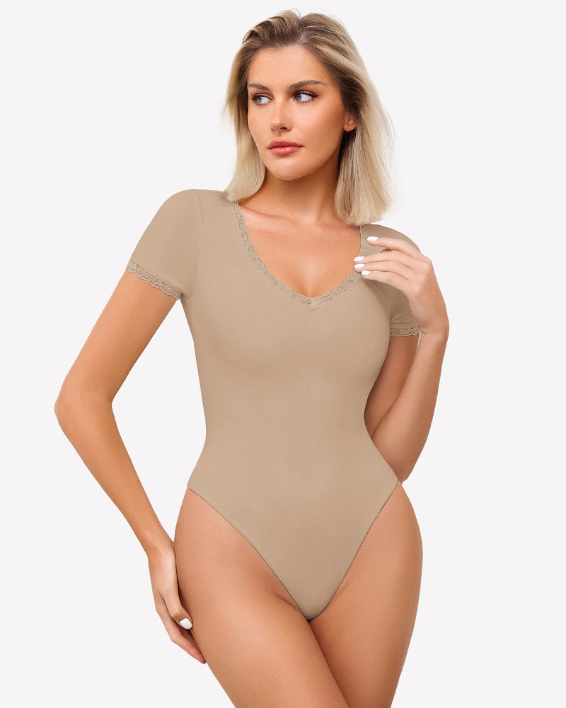 Beige short sleeve V-neck bodysuit with lace trim, light smoothing and flattering fit.