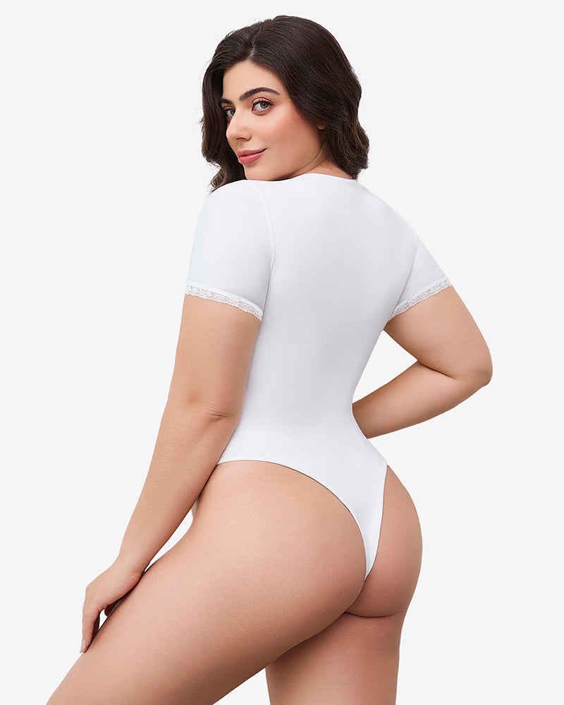 White short sleeve V-neck bodysuit with lace trim, offering light smoothing and a flattering fit.