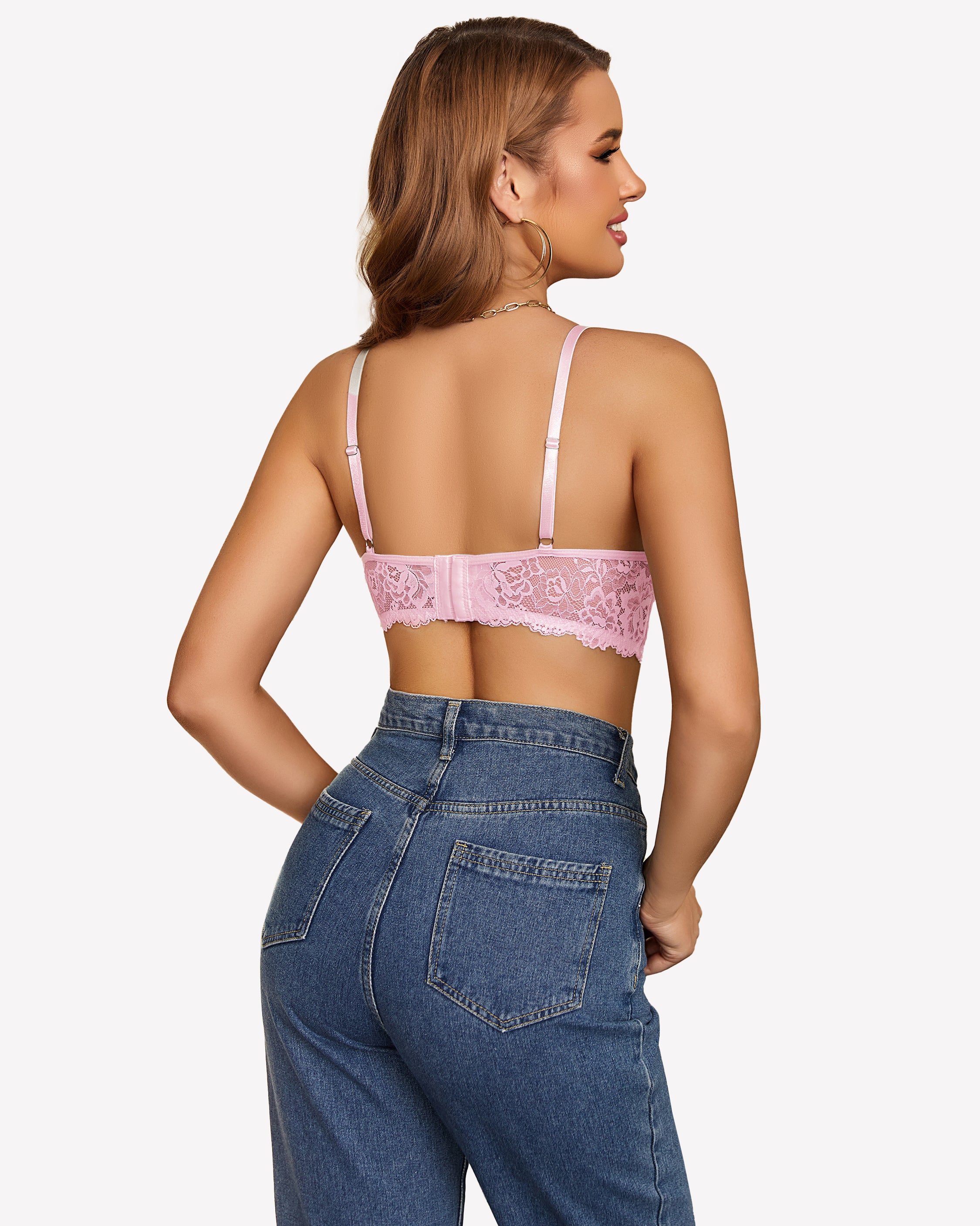 Pink lace bralette with adjustable straps and blue jeans. Sexy lingerie for women.