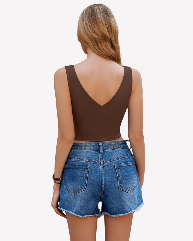 Brown crop plunge tank top camisole with V-neck and wide straps, paired with denim shorts