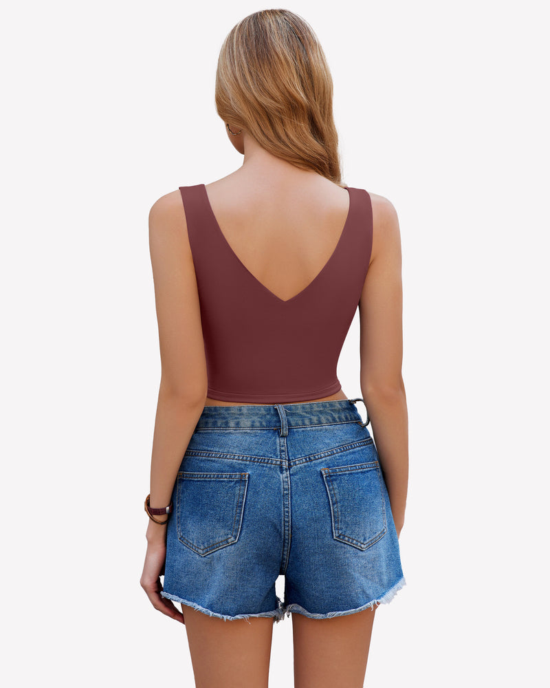Maroon crop plunge tank top camisole with V-neck and wide straps, paired with denim shorts