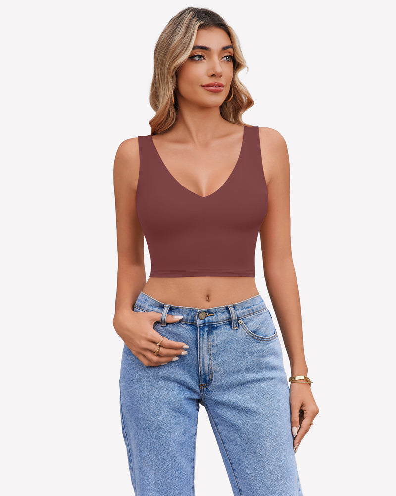 Maroon V-neck crop top camisole with wide straps, paired with light blue jeans, a stylish look.