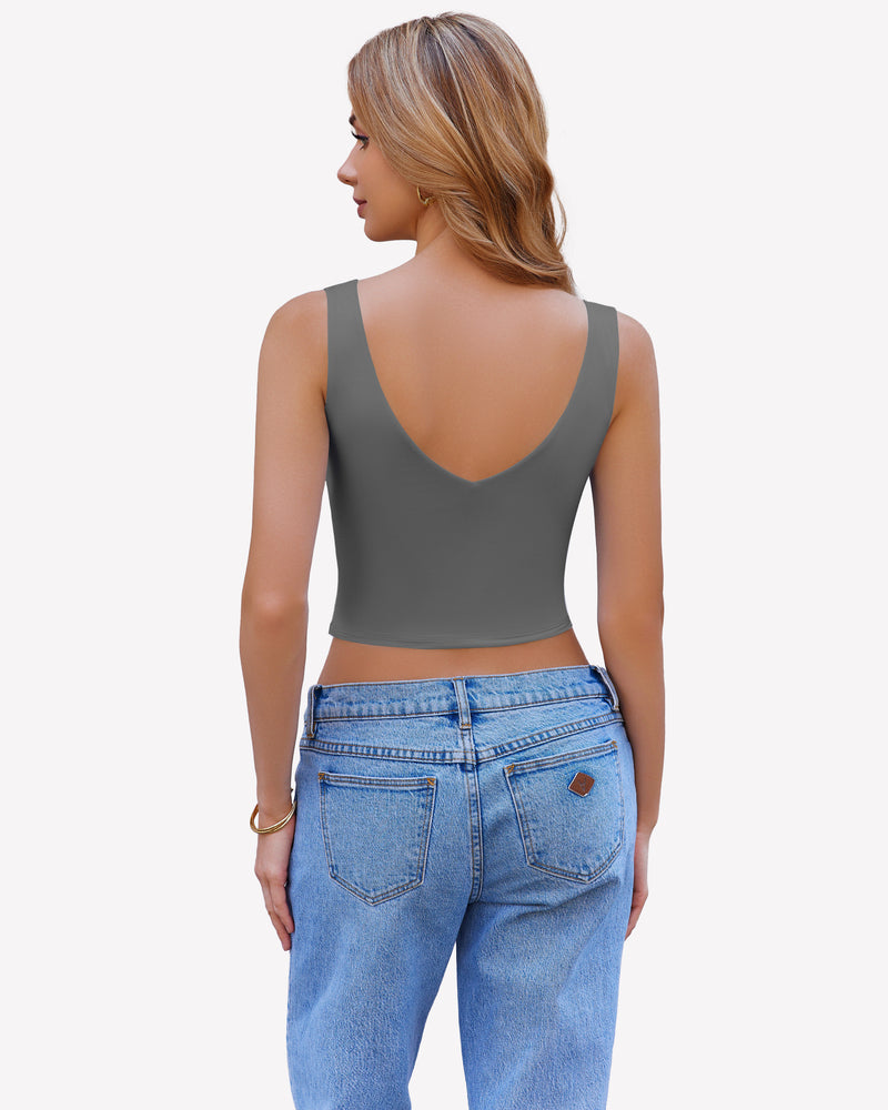 Gray V-neck crop top camisole with wide straps and light blue jeans, a stylish look.