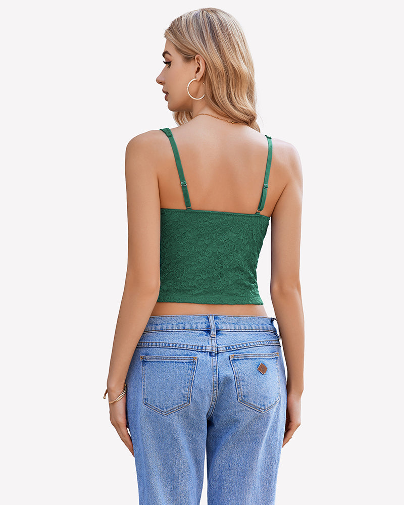 Green lace crop top with adjustable straps, perfect for party or date night, paired with blue jeans.