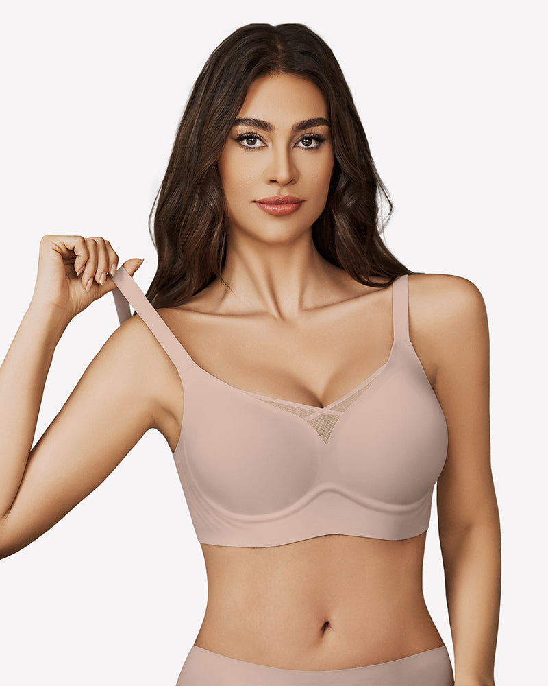 Nude seamless bralette with mesh crossover design and adjustable straps for support and comfort