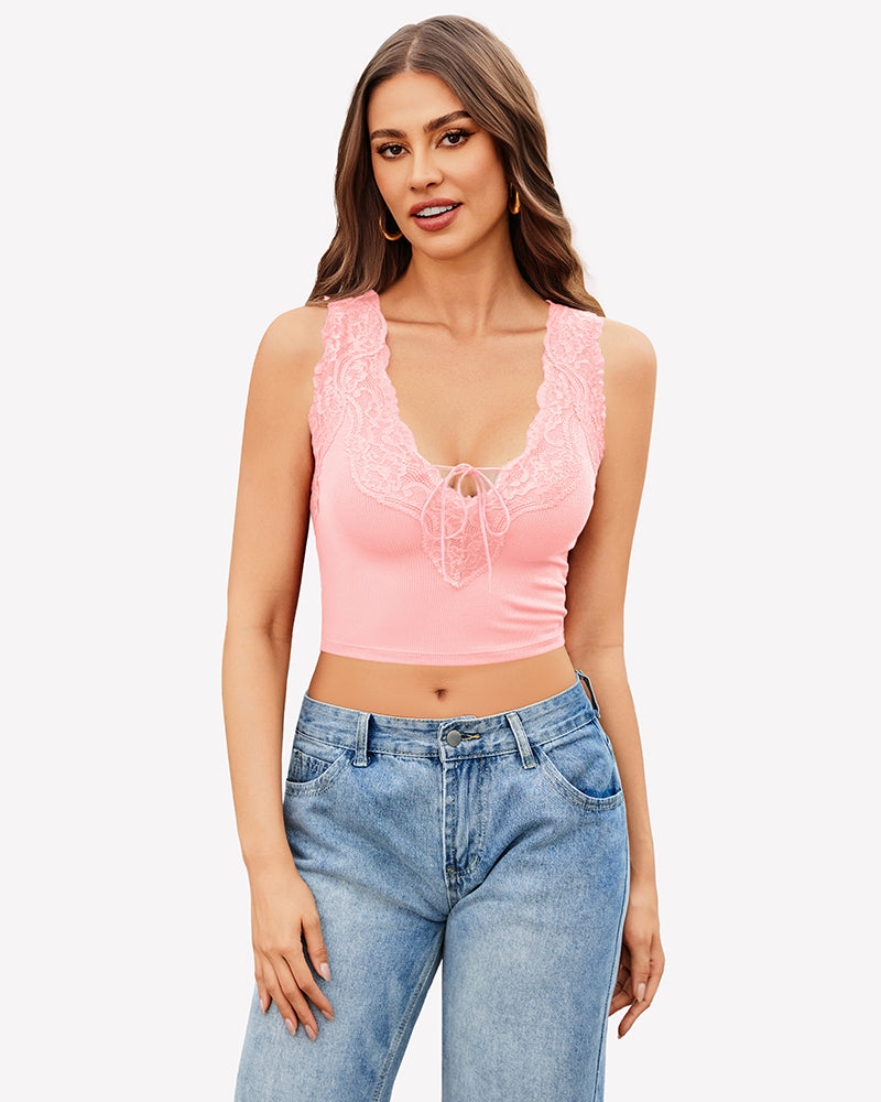 Pink V-neck crop top with lace trim and tie-up front, paired with jeans. Sexy and charming style.