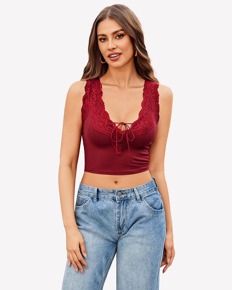 Burgundy V-neck crop top with lace trim, tie-up front, paired with jeans. Sexy and charming.