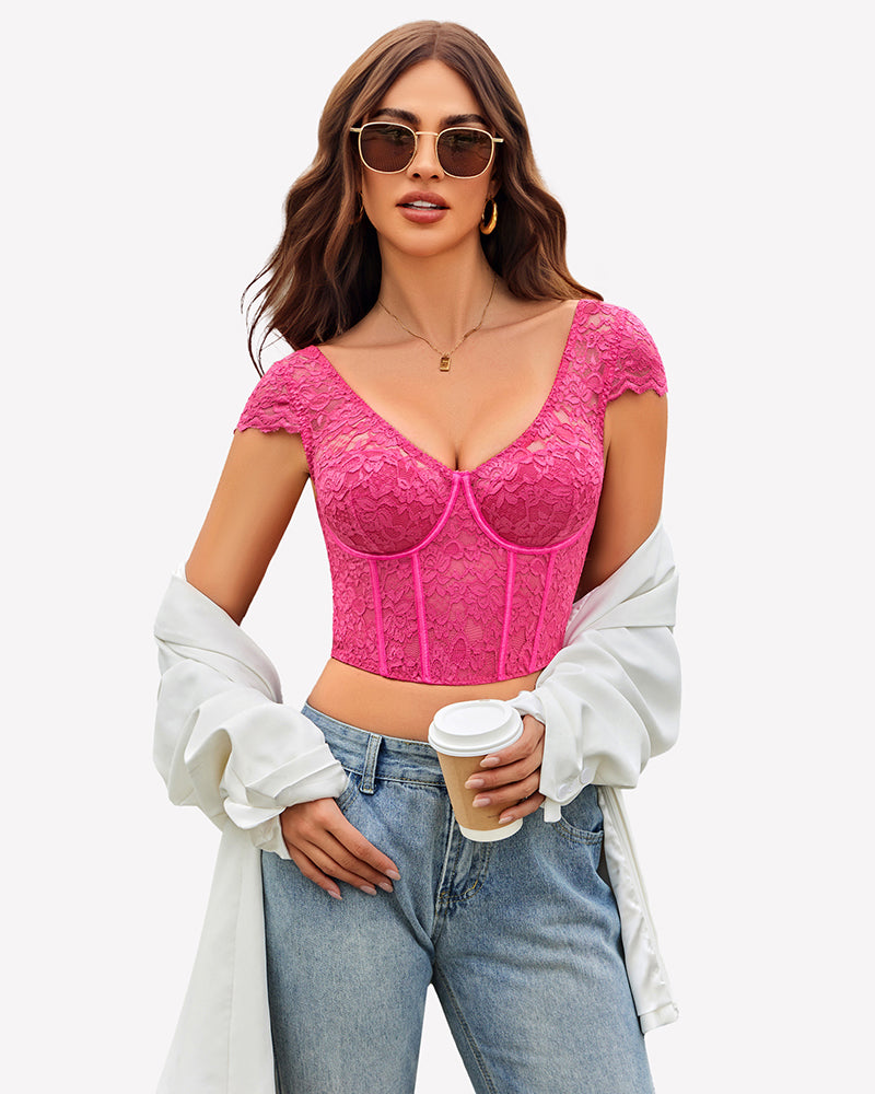 Pink floral lace bustier crop top with cap sleeves, styled with blue jeans and sunglasses