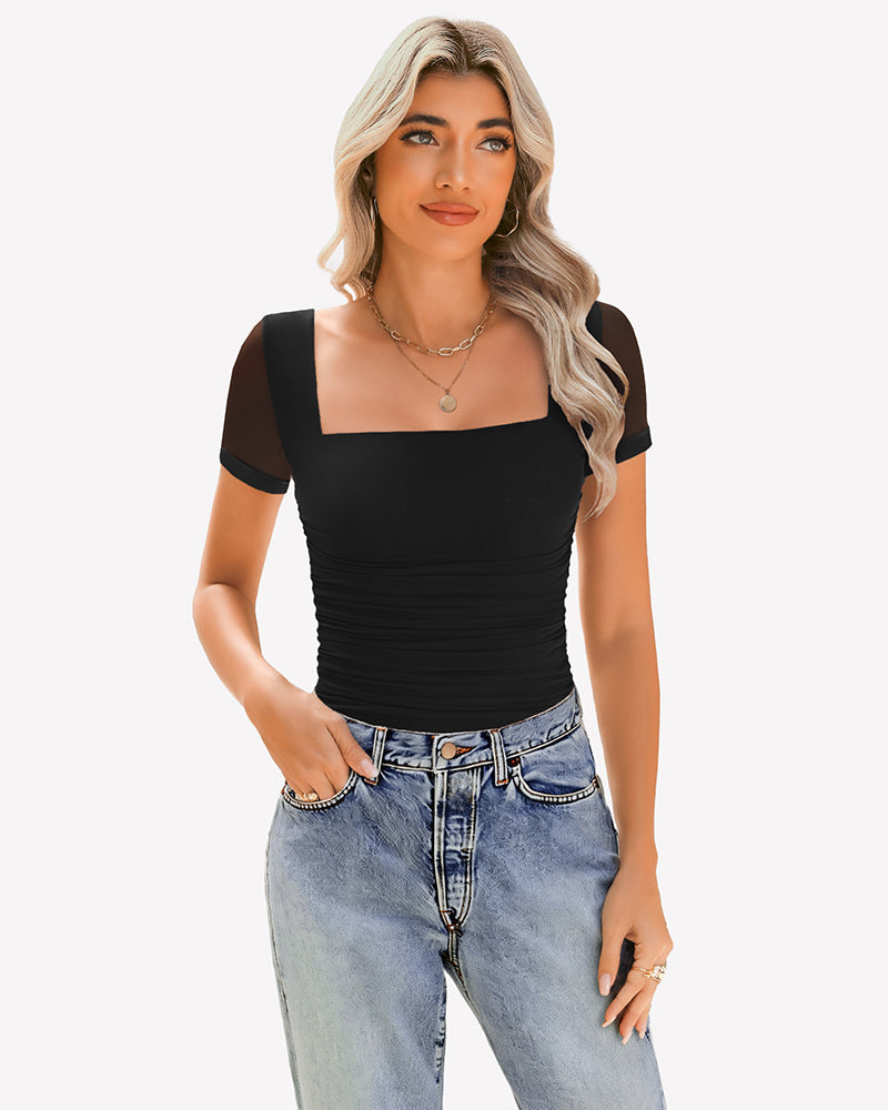 Black sheer mesh ruched top with square neck, paired with jeans. Soft, breathable fabric.
