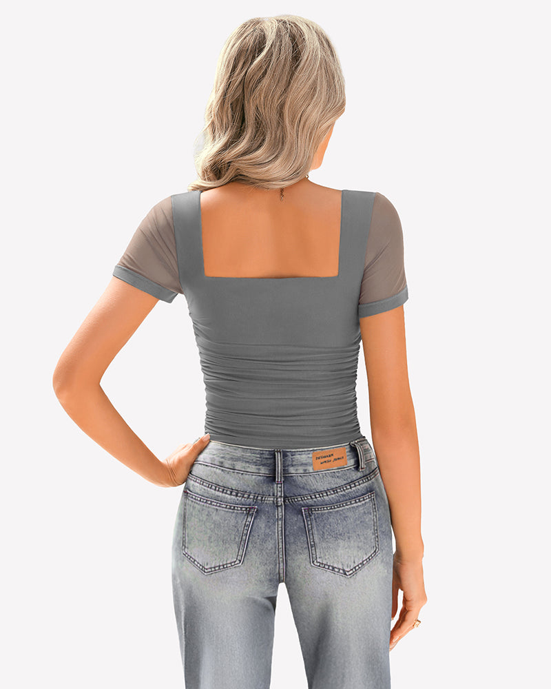 Gray mesh short sleeve ruched top with square neck, paired with jeans. Soft, breathable fabric.