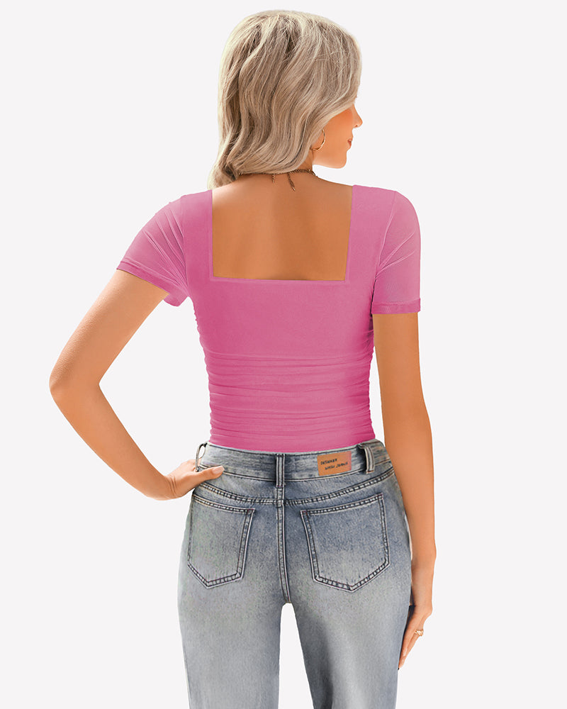 Pink sheer mesh ruched top with square neck and jeans. Soft, breathable fabric.