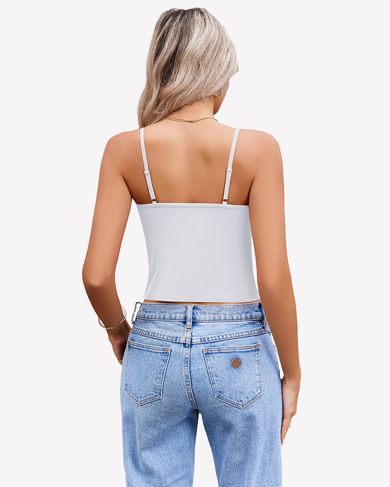 White spaghetti strap crop top for women, paired with light blue jeans. Summer tank top.