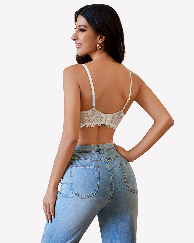 White lace V-neck bra with adjustable straps, paired with jeans. Stylish lingerie for women.