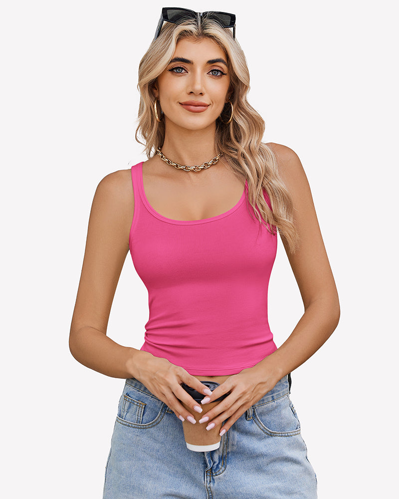 Pink ribbed racerback top, scoop neck, sleeveless, paired with denim shorts. Summer fashion.