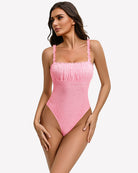 Pink lace thong bodysuit with square neckline and ruffled straps, full front