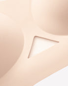Close-up of nude padded jelly bralette fabric with triangle mesh cutout detail.