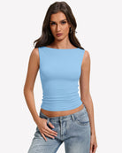 Light blue boat-neck sleeveless ruched top, fitted waist