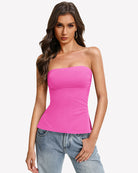 Double-lined strapless tube top in bright pink with ruched bust, side-slit hem