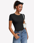 Black short-sleeve snap bodysuit, crew neck, fitted one-piece leotard top.