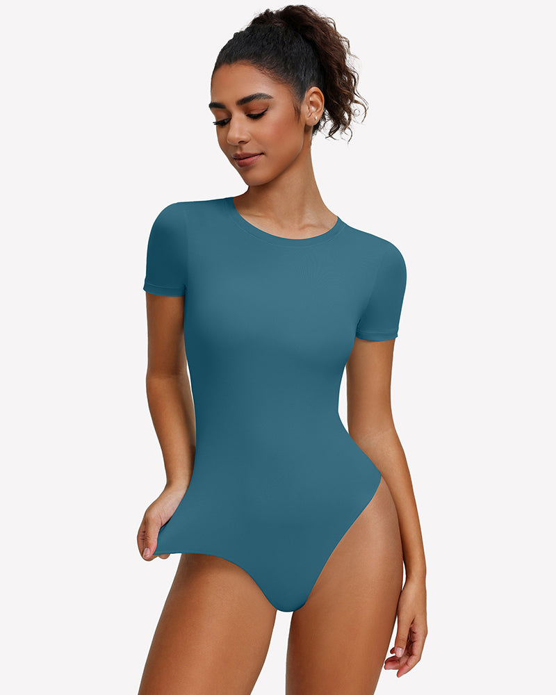 Light blue short-sleeve snap bodysuit, fitted one-piece leotard top.